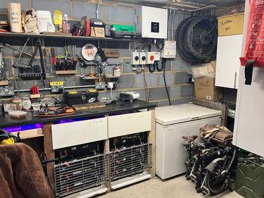 Workshop with tools and Fox ESS power system setup